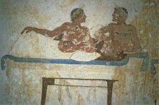 Fresco depicting two men lying on a bed in the Tuffatore tomb at Paestum