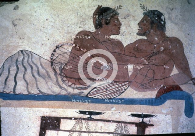 Fresco in the tomb of Tuffatore representing two men at a banquet.
