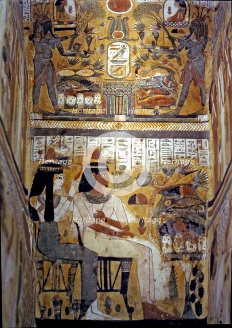 Frescoes inside a sarcophagus in wood.