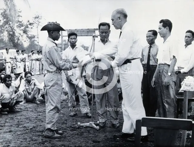 Fritz Ronnefeldt distributing medicine, c1940s. Creator: Unknown.