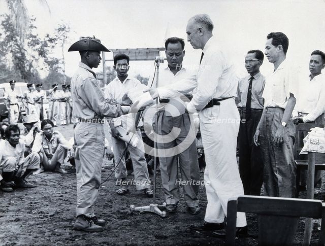 Fritz Ronnefeldt distributing medicine, c1940s. Creator: Unknown.