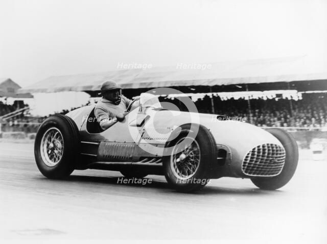 Froilan Gonzalez driving a Ferrari, early 1950s. Artist: Unknown