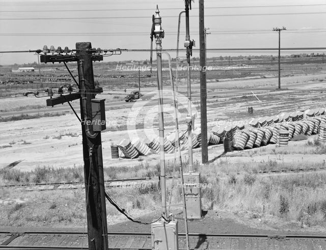 From the overpass approaching Fresno, between Tulare and Fresno, California, 1939. Creator: Dorothea Lange.