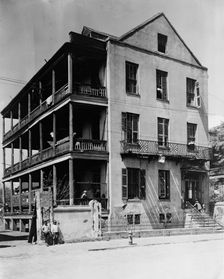 Front and side view of apartment(?) house, 61 Washington Street, Charleston, South..., c1933 - 1940. Creator: Frances Benjamin Johnston