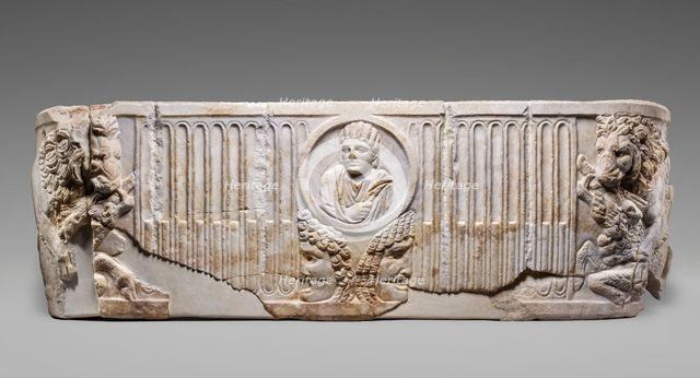 Front of a Sarcophagus with Female Portrait in a Medallion above Two Theatrical Masks...250-275. Creator: Unknown.