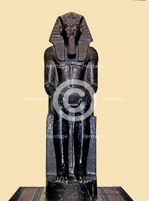 Front view of the seated statue of Ramses II, made in diorite, it comes from Tanis.