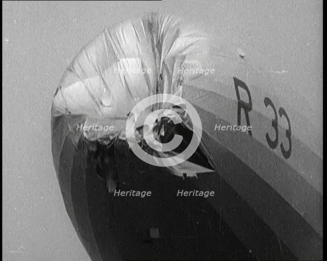 Front View of the 'R.33' Zeppelin With a Dented and Damaged Nose After Flying Through a Storm, 1924. Creator: British Pathe Ltd.