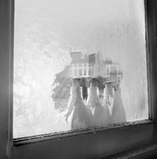 Frozen milk bottles, 1960-1965. Artist: John Gay