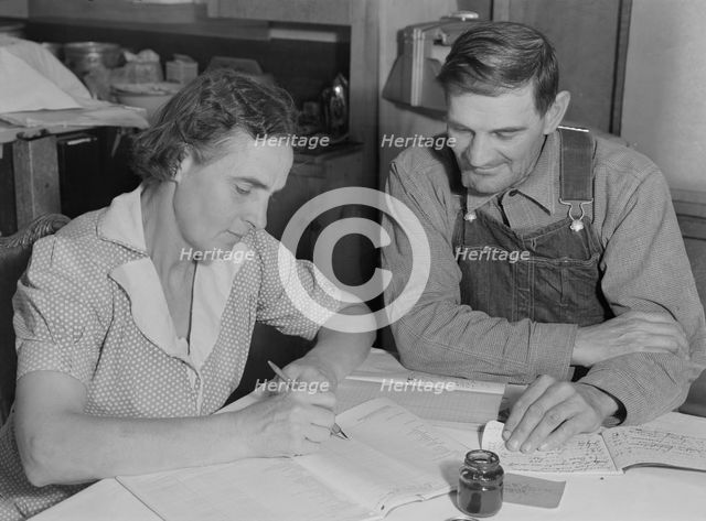 FSA borrowers on new farm keep account of their loan, Dead Ox Flat, Malheur County, Oregon, 1939. Creator: Dorothea Lange.