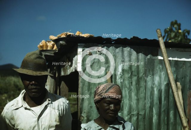 FSA - Tenant Purchase borrower? in front of their house, Puerto Rico, 1941 or 1942. Creator: Jack Delano.