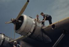 Fueling a plane at the Naval Air Base, Corpus Christi, Texas, 1942. Creator: Howard Hollem