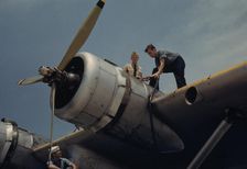 Fueling a plane at the Naval Air Base, Corpus Christi, Texas, 1942. Creator: Howard Hollem