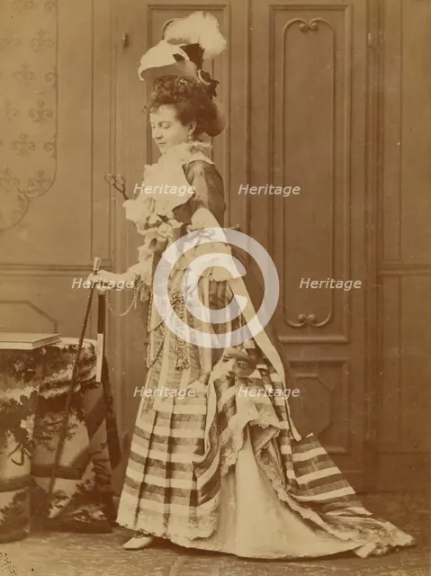 Full-length portrait of a well-dressed woman with walking stick, 1880s. Creator: Michele Schemboche.