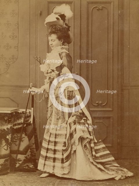 Full-length portrait of a well-dressed woman with walking stick, 1880s. Creator: Michele Schemboche.