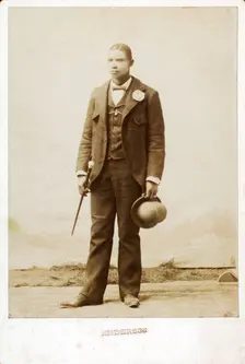 Full length portrait of man with bowler hat and cane, c1890-c1899. Creator: Anderson