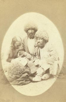 Full-length portrait of three men, seated on ground, facing front, between 1870 and 1886. Creator: Unknown
