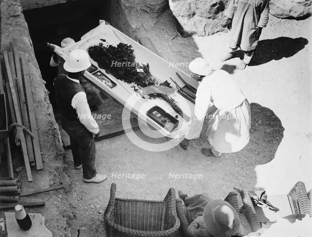 Funeral bouquet being removed from the tomb of Tutankhamun, Valley of the Kings, Egyp, 1922. Artist: Harry Burton