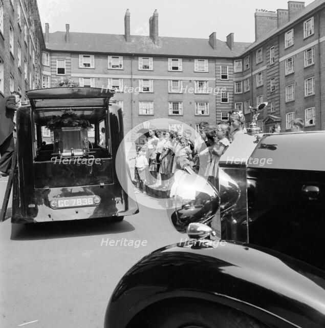 Funeral on a council estate, London, 1960-1965. Artist: John Gay