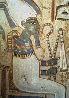 Funerary stela representing god Osiris, made in polychromed limestone. From Thebes