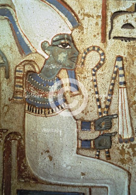 Funerary stela representing god Osiris, made in polychromed limestone. From Thebes.