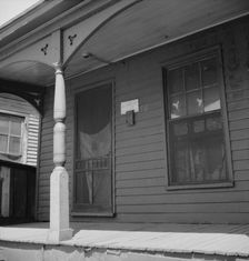 Furnish room in the Negro quarter from which cotton hoers are recruited, Memphis, Tennessee, 1937. Creator: Dorothea Lange