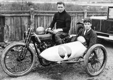 FW Dixon on a Harley-Davidson, with a passenger in the sidecar, 1921