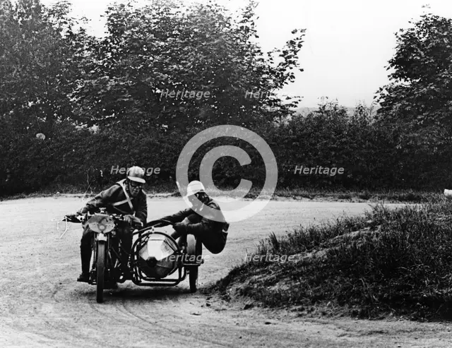 G Tucker racing a Norton bike, 1924. Artist: Unknown