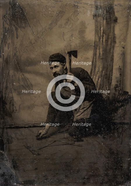 [Kneeling Carpenter Holding a Nail and Raised Hammer], 1870s-80s. Creator: Unknown.