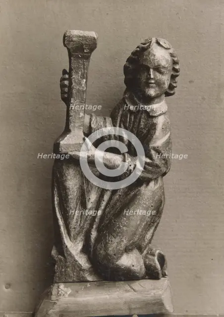 Kneeling figure with a candlestick, (1925-1930).  Creator: Unknown.
