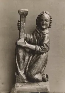 Kneeling figure with a candlestick, (1925-1930). Creator: Unknown