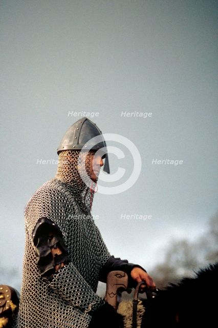 Knight on horseback, from a battle re-enactment.  Artist: Geoffrey Davis