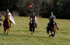 Knights on horseback, during a battle re-enactment. Artist: Geoffrey Davis
