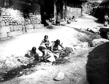 Korean children in the street, Nam San, Korea, 1900