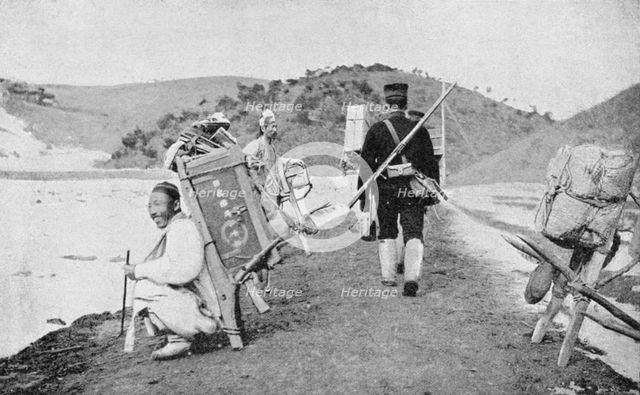 Korean coolies acting as porters for Japanese soldiers, Russo-Japanese War, 1904-5. Artist: Unknown