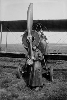 Katherine Stinson with her biplane, 1917 or 1918. Creator: Bain News Service