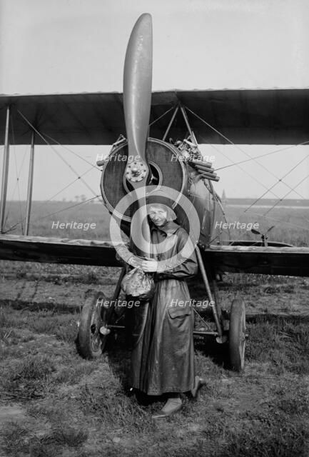 Katherine Stinson with her biplane, 1917 or 1918. Creator: Bain News Service.