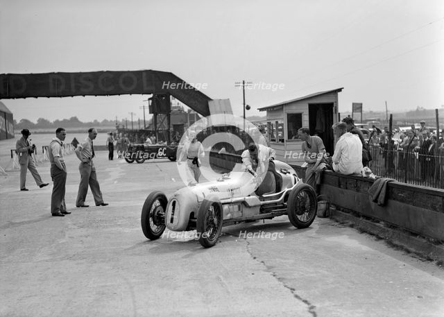 Kay Petre in an Austin 7 works team racing car, Brooklands, 1937. Artist: Bill Brunell.