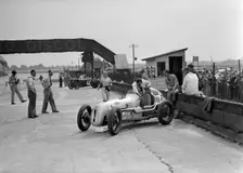 Kay Petre in an Austin 7 works team racing car, Brooklands, 1937. Artist: Bill Brunell