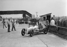 Kay Petre in an Austin 7 works team racing car, Brooklands, 1937. Artist: Bill Brunell