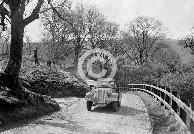 Kay Petre's Singer Nine competing in the RAC Rally, 1939. Artist: Bill Brunell.