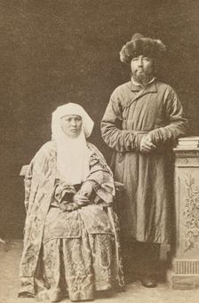 Kazakh man and woman, full-length portrait, between 1870 and 1886. Creator: Unknown