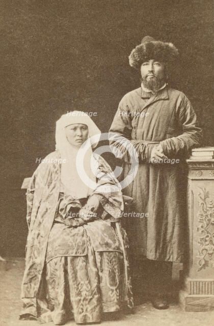Kazakh man and woman, full-length portrait, between 1870 and 1886. Creator: Unknown.