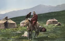 Kazakh with a Golden Eagle, on a Horse with Yurts in the Background, Valley of the Arakan...,1911-13 Creator: Sergei Ivanovich Borisov