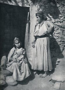 Kabyle women at the door of their dwelling near the Mediterranean coast, Algeria, 1912.. Artist: Kuhn