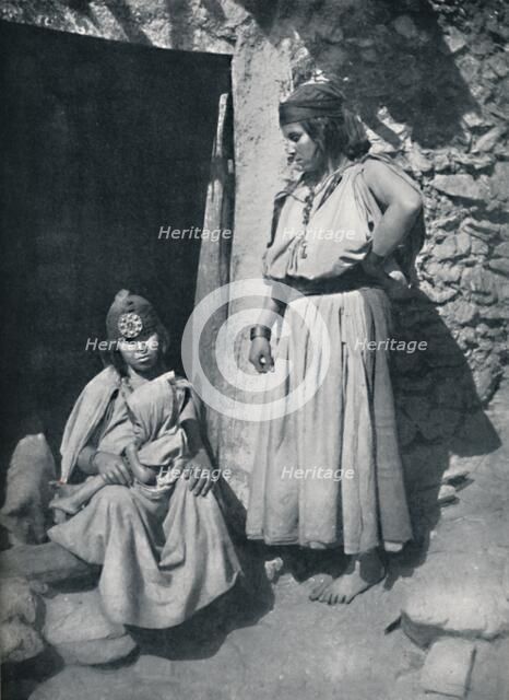Kabyle women at the door of their dwelling near the Mediterranean coast, Algeria, 1912.. Artist: Kuhn.