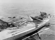 Kaiak with seal hunting equipment, Nunivak, c1929. Creator: Edward Sheriff Curtis