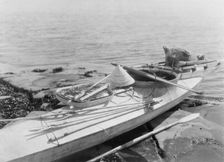 Kaiak with seal hunting equipment, Nunivak, c1929. Creator: Edward Sheriff Curtis
