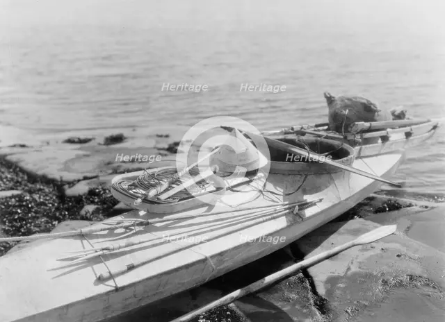 Kaiak with seal hunting equipment, Nunivak, c1929. Creator: Edward Sheriff Curtis.