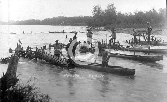 Kamchadals on baht pull out fish from the “muzzles” of the “constipation”..., 1910-29. Creator: Ivan Emelianovich Larin.