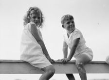 Kane children, seated on a fence, between 1911 and 1942. Creator: Arnold Genthe